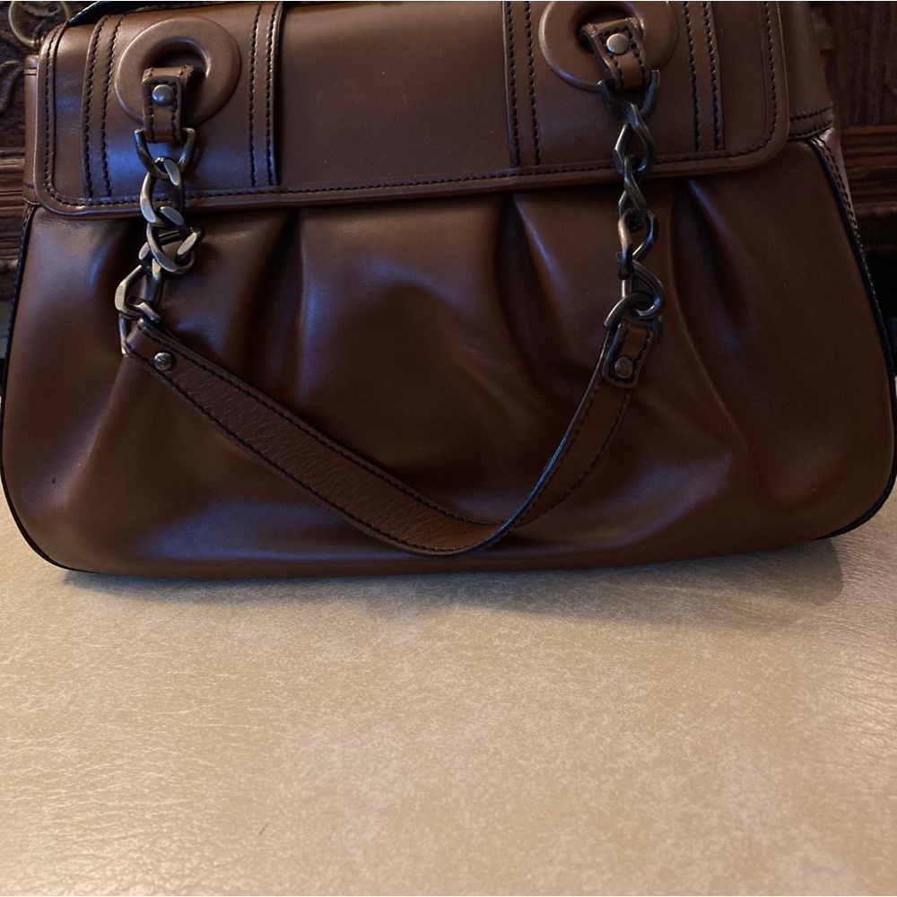Beautiful Fendi Leather Bag.Have 2 handles of Chain & leather and rummy.